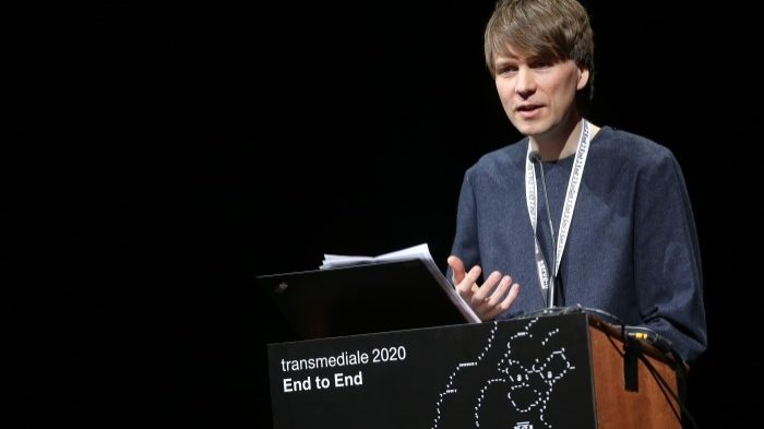 Picture of Kristoffer Gansing delivering a talk at transmediale 2020 in Berlin.