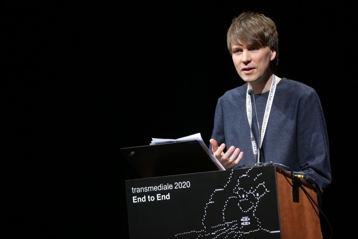 Picture of Kristoffer Gansing delivering a talk at transmediale 2020 in Berlin.